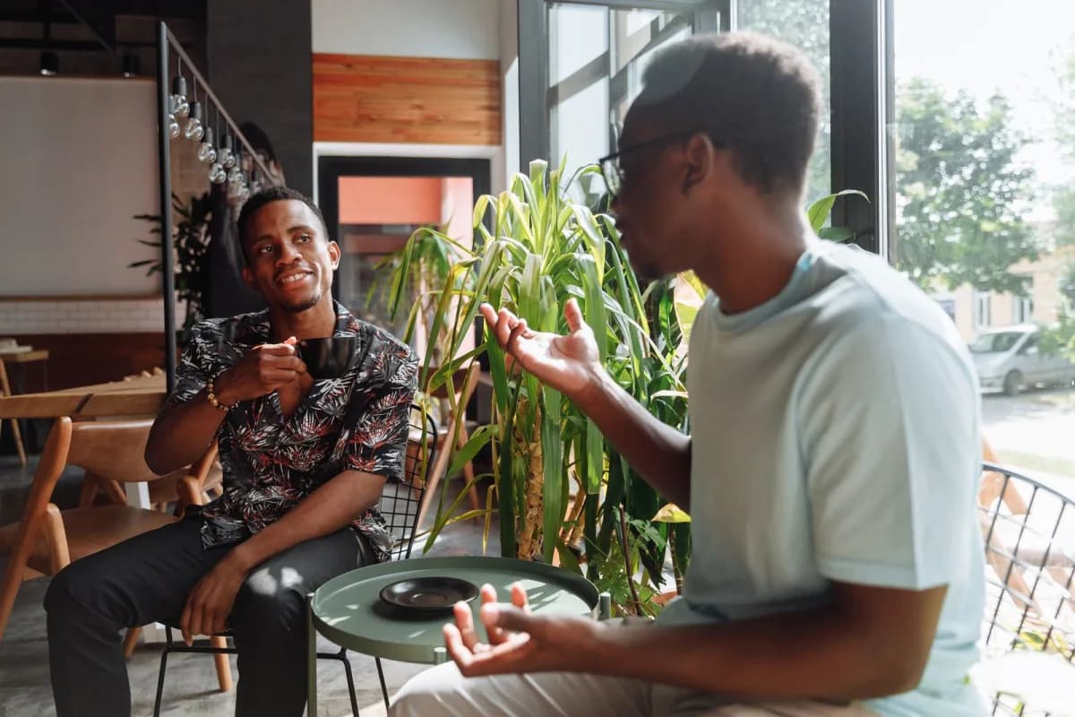 Two friends having an honest conversation over coffee